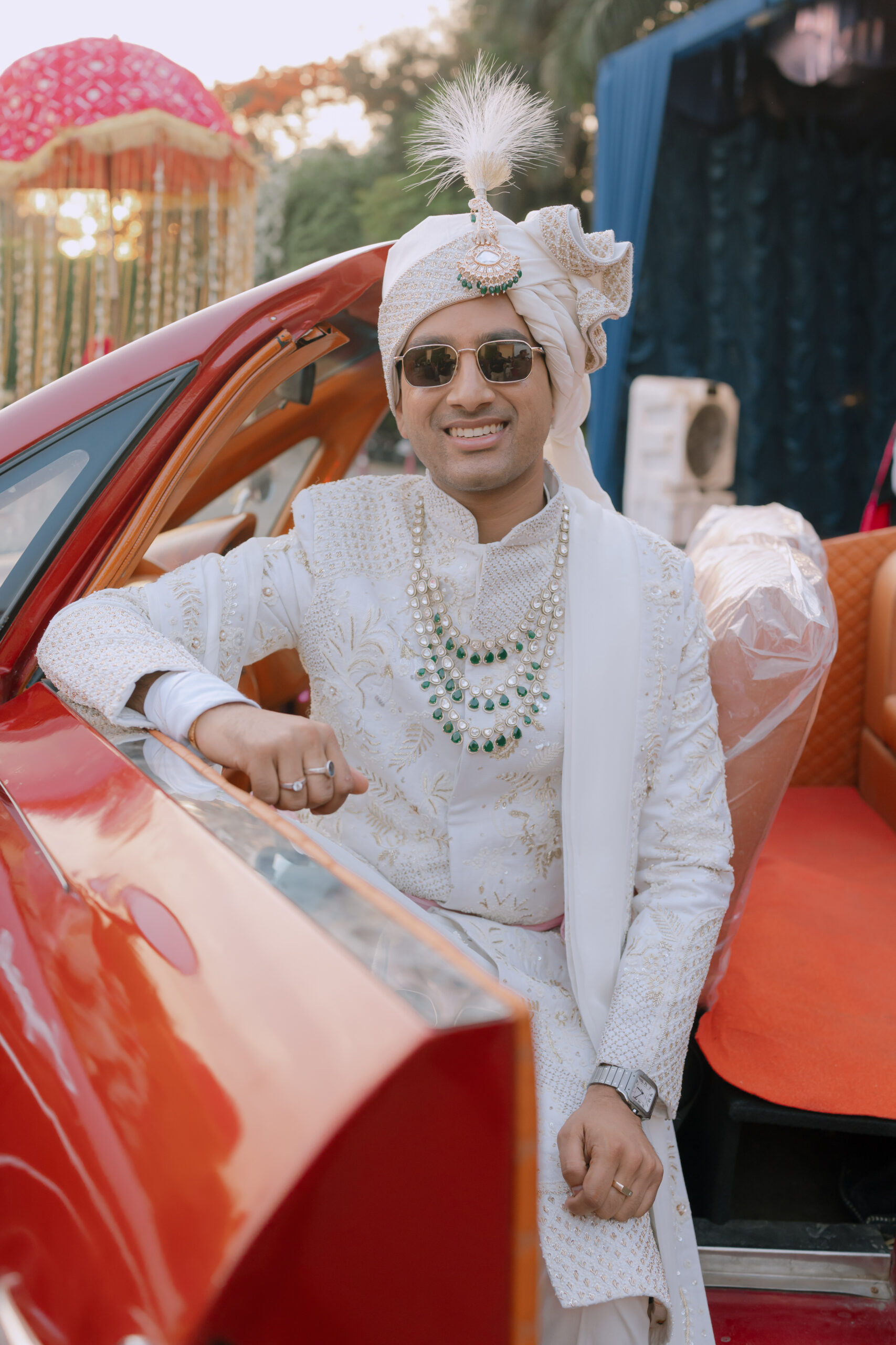 Groom making a grand wedding entry in luxury car at wedding ceremony in Chandigarh by The Dew Co