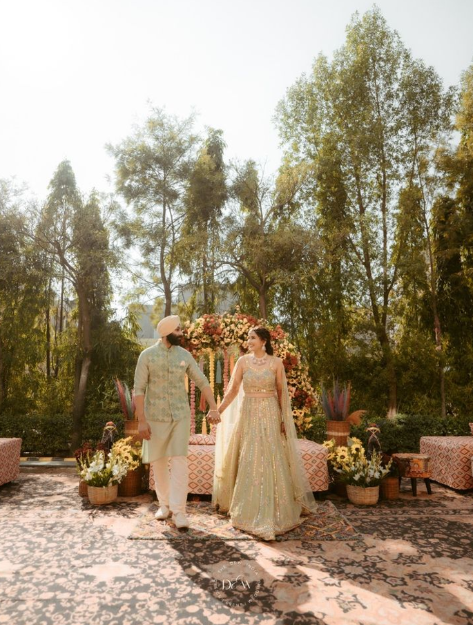 Punjabi wedding mandap and reception décor with warm lighting