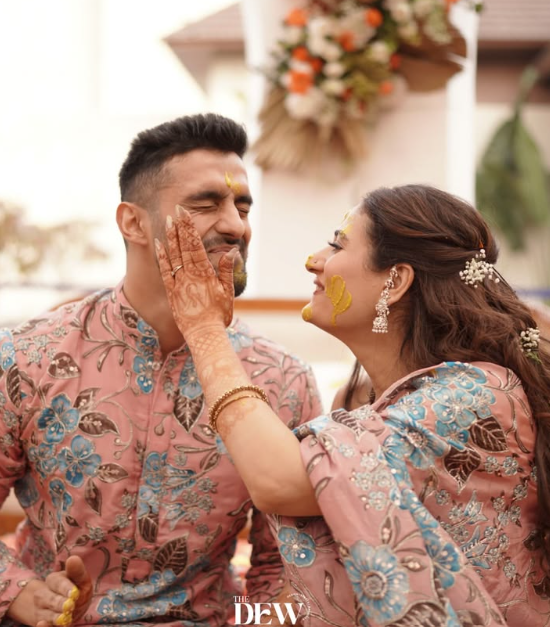 Elegant Sikh wedding ceremony setting with floral arrangements