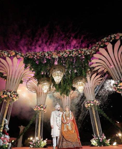 Punjabi wedding reception venue with elegant floral stage décor